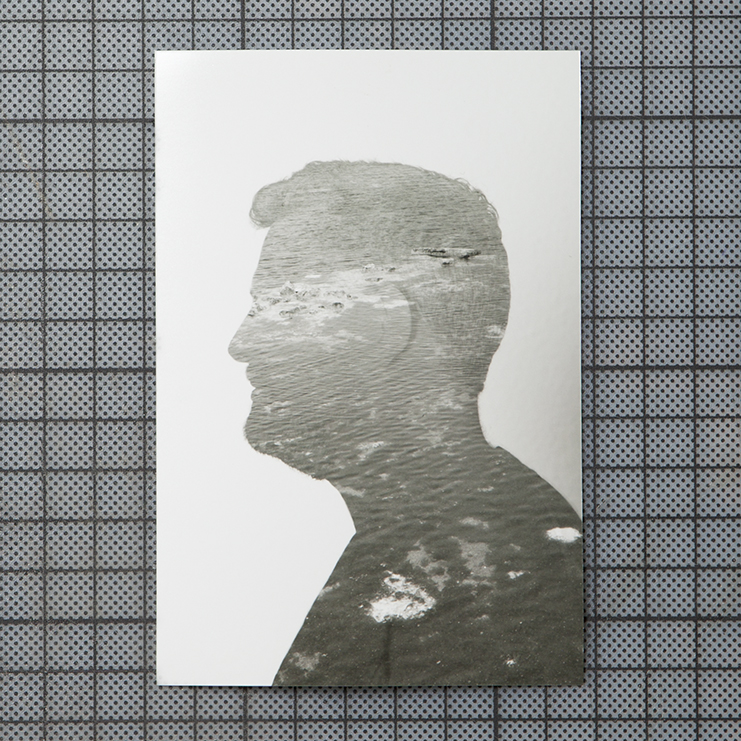 the photograph shows the profile of a man which is filled by a photograph of the sea