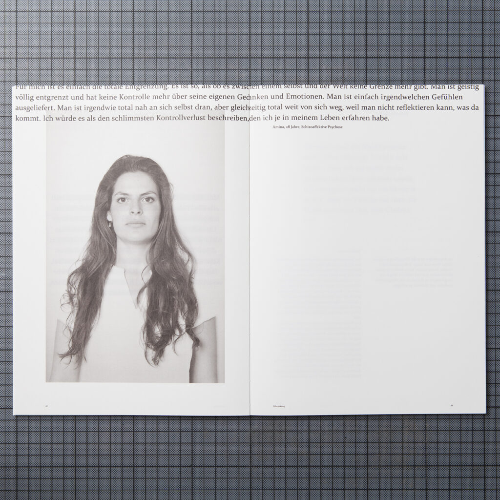the double page shows a photograph of a woman of which t-shirt is cut off so you see the wall behind her instead. above the image is a long quote which reaches from the left edge over the fold to the right edge.