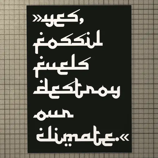 the poster shows the white words "yes, fossil fuels destroy our climate" in an arabic typeface on a black background