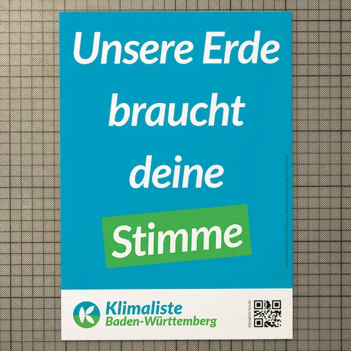 the election poster shows the slogan "our earth needs your vote" on a green background with the logo, website and qr-code